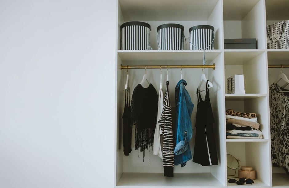 Bright, tidy home interior with a neatly organized wardrobe